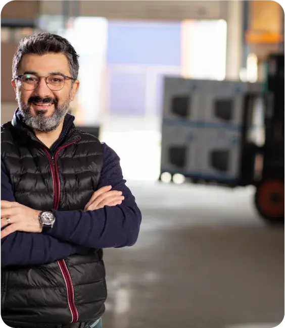 Small business owner standing in warehouse